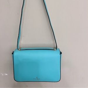 Kate Spade purse in w Tiffany blue color with silver bow enclosure